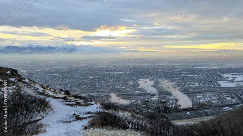 Ensign Peak sunset shows Salt Lake City valley and refinery steam