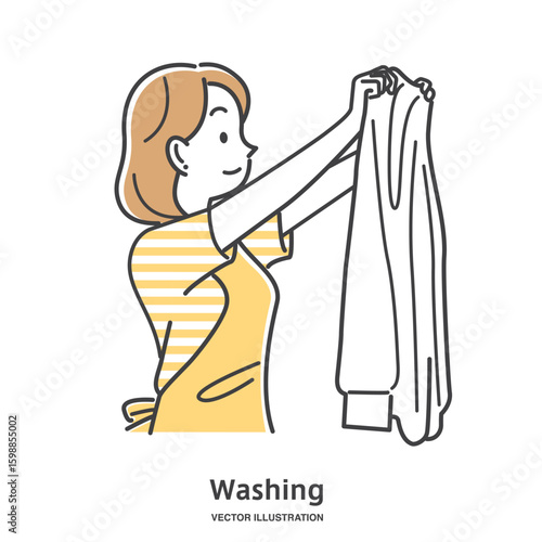 洗濯物を干すエプロン姿の若い女性