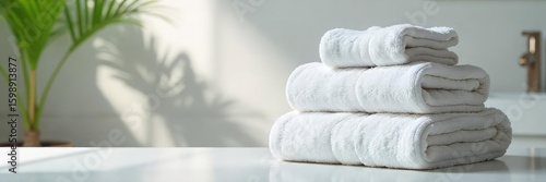 A neatly organized pile of fluffy bath towels, neatly folded and stacked high, ready for use in a clean bathroom Soft light illuminates the fresh, clean cotton textiles , resort, shower