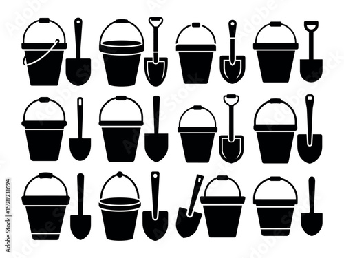 Black buckets and shovels sand beach