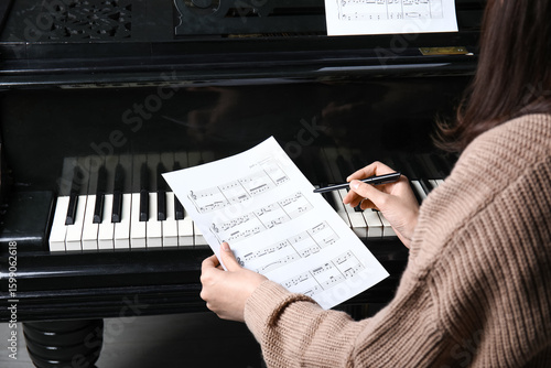Young woman composing music...