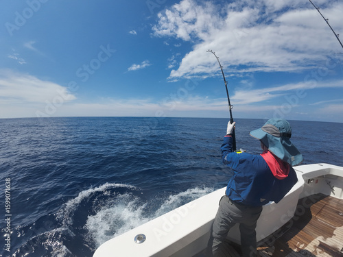 Sport fishing adventure off the coast of Costa Rica — aerials and onboard shots of yachts, deep sea fishing rods, and anglers in action under dramatic ocean skies