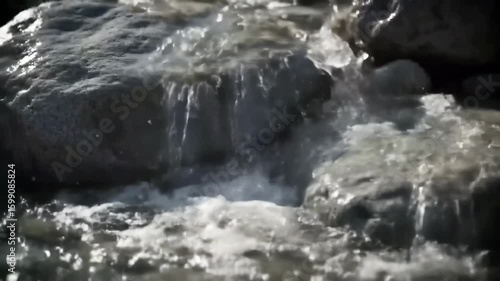 Wallpaper Mural Cascading water flows over rocks in a small stream or waterfall. Torontodigital.ca