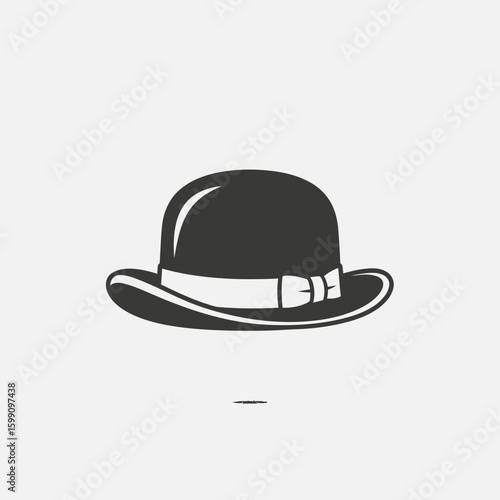 A black bowler hat with white band isolated on a light background.