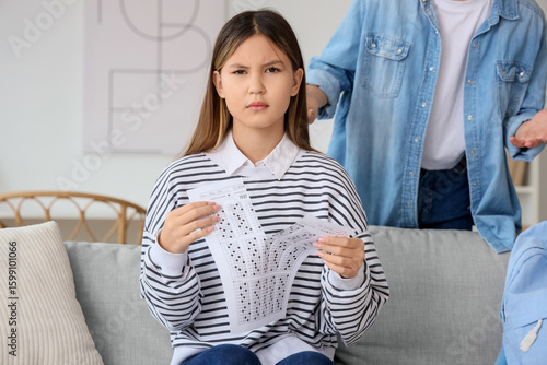 Upset teenage girl tearing ...