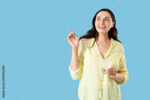 Young woman with glass of w...
