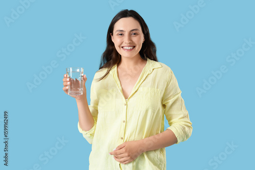 Young woman with glass of w...
