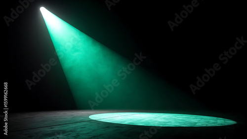 Bright green spotlight beam illuminating a dark stage floor