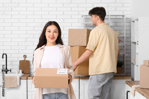 Young couple with parcel bo...