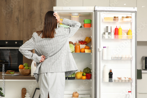 Thoughtful businesswoman ne...