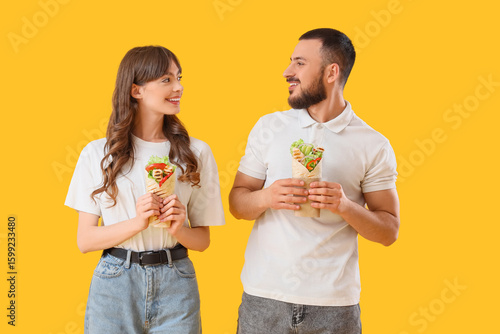Young couple with tasty san...