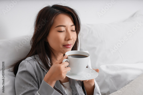 Relaxed asian woman enjoyin...