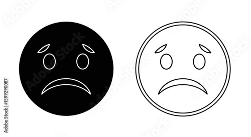 Two sad face icons one filled with black and one outlined on a white background