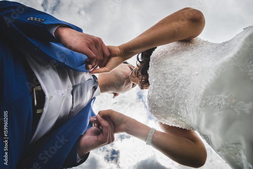 A Loving Couple Under Cloudy Skies