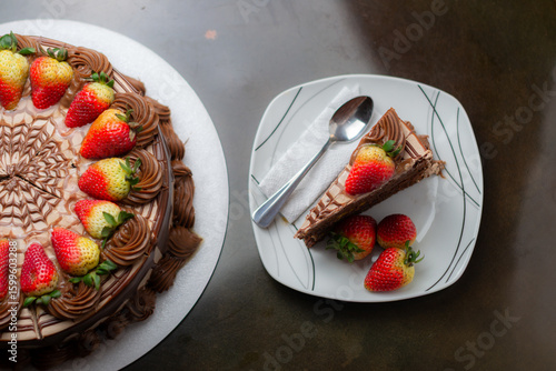 Top view Chocolate Drip Cake with Strawberries on Elegant Display