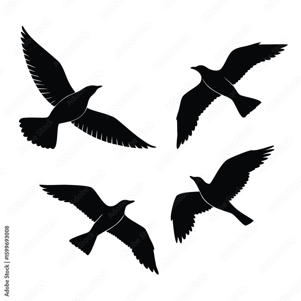 Obraz premium Four Black Bird Silhouettes Flying Vector Elements