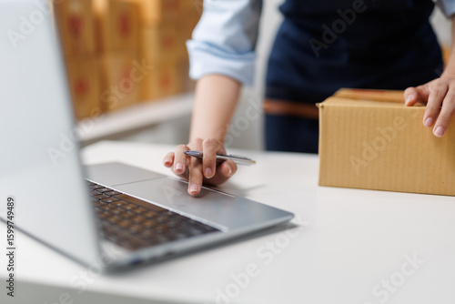 Startup small business entrepreneur or freelance woman working at home office, packaging and delivery situation for online shopping and e commerce or drop shipping concept