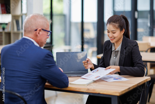 Wallpaper Mural Businesswoman financial expert analyzes business report graph and chart at the office. Concept of financial economy and marketing research.	 Torontodigital.ca