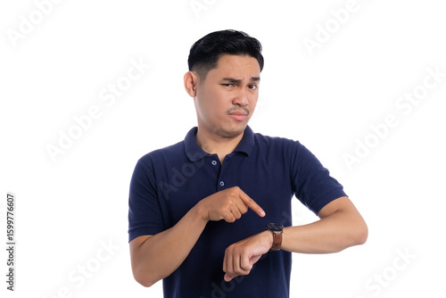 Slika na platnu Serious man pointing at wristwatch while looking impatient isolated on transpare
