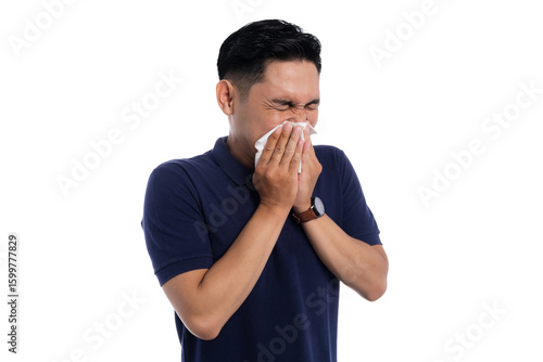 Sick man sneezing into tissue with eyes closed showing flu or allergy symptoms isolated on transparent background