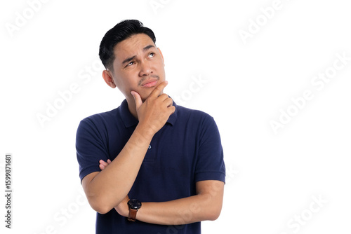 Thoughtful Asian man touching chin and looking up with thinking expression isolated on transparent background