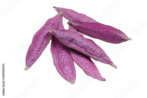 a bunch of purple beans on a white surface