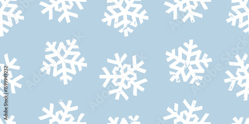 Seamless abstract horizontal winter Christmas pattern of big paper snowflakes on blue background, chalk texture; simple hand drawn cute vector illustration, flat style