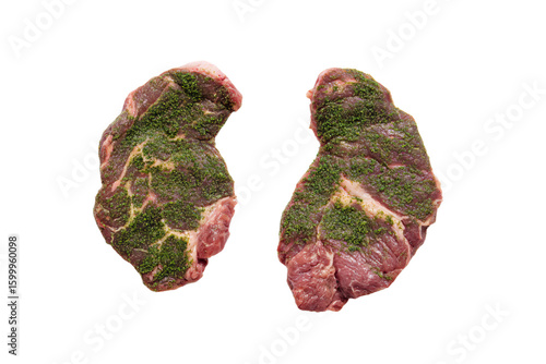 two pieces of meat with green stuff on them