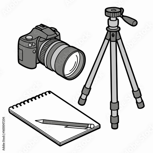 Gray camera tripod notebook and pencil on white photography