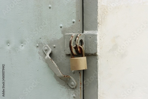 Old rusty steel door and padlock background