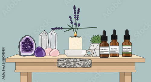 Aromatherapy and crystal healing setup with essential oils, candle, and crystals on a table