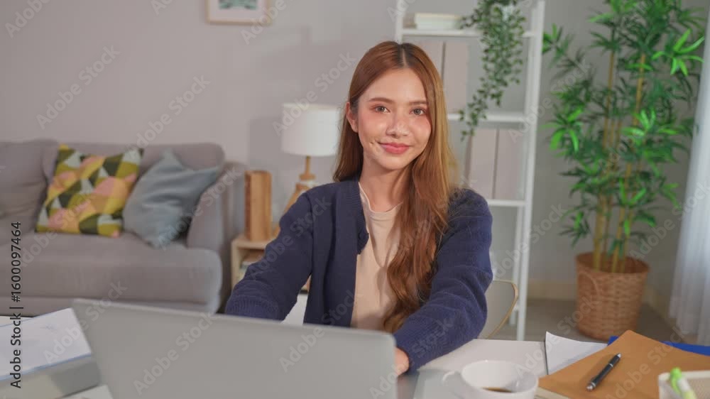 Portrait of Asian woman freelancer using laptop device working in house. Portrait of Asian woman freelancer using laptop device working in house.