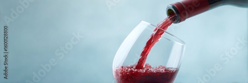 Red wine cascades vividly into the glass, capturing vinous elegance, vivacious earth notes, evoking International Wine Day celebrations