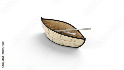 A Woven Basket Boat with Silver Oars Resting on a Pure White Surface Evoking Nautical Charm and Handcrafted Artistry for Decorative Display