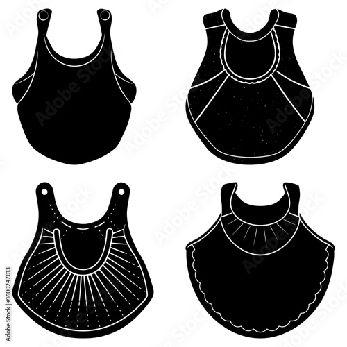 Four black and white bibs with different designs arranged in a square formation on a white background
