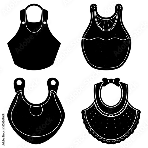 Four black and white baby bibs with different designs arranged in a square formation on a white background