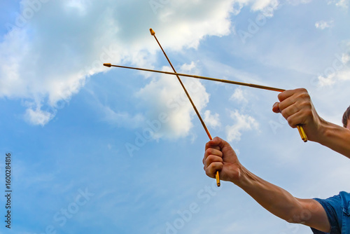Photos Dowsing with metal indicator L rods in hands is a modern tool of a dowser