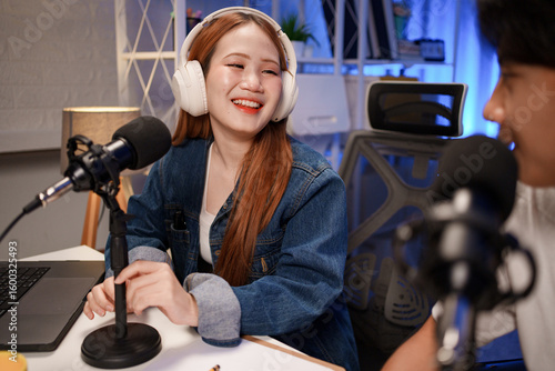People in the podcast studio talking and recording