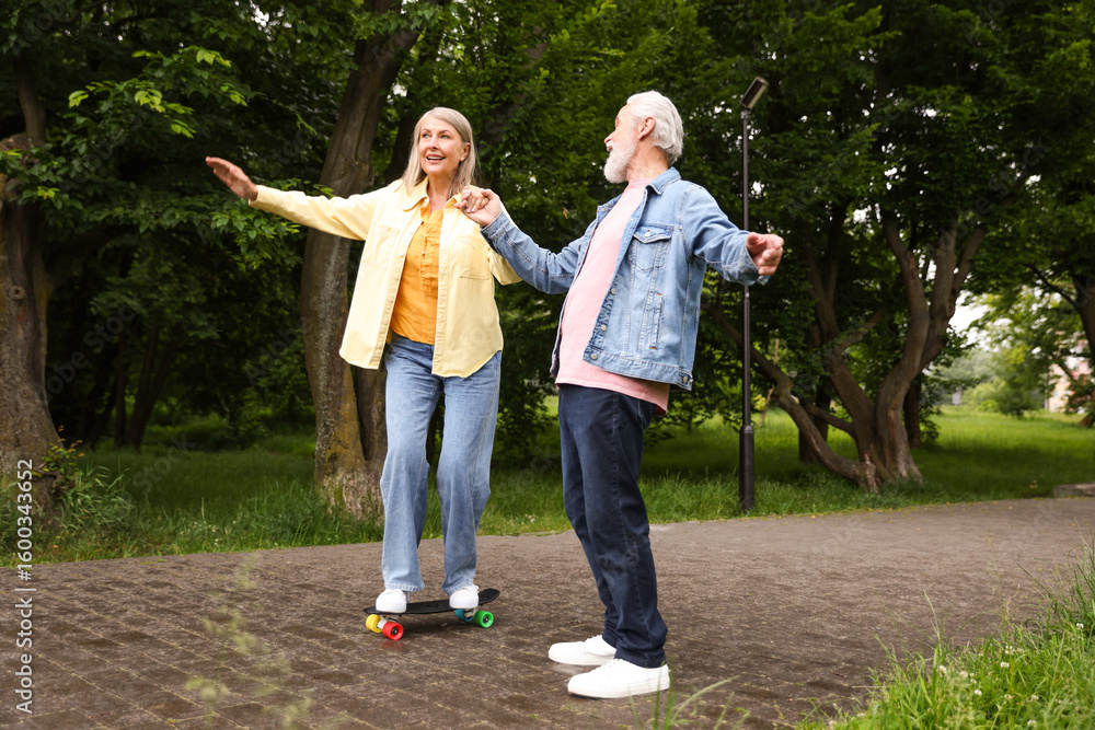 Lovely senior couple having fun together in park Lovely senior couple having fun together in park