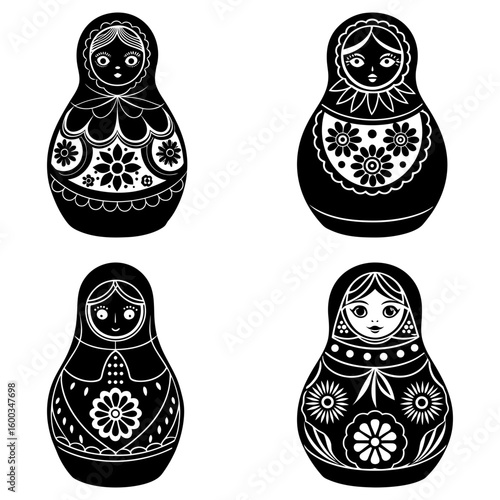 Four black and white matryoshka dolls with floral and decorative patterns on a white background display