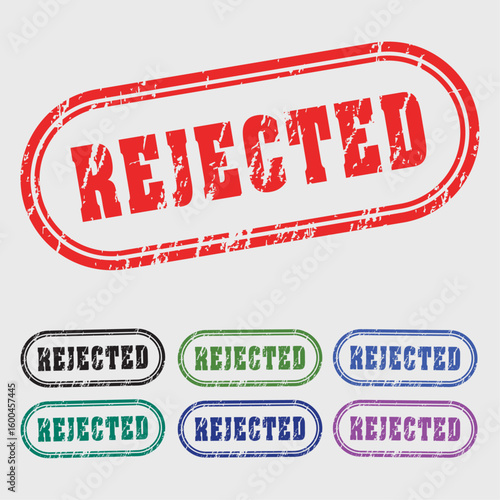 Rejected Rubber Stamps: A collection of vividly colored rubber stamps boldly proclaim REJECTED, conveying a strong sense of disapproval and denial.