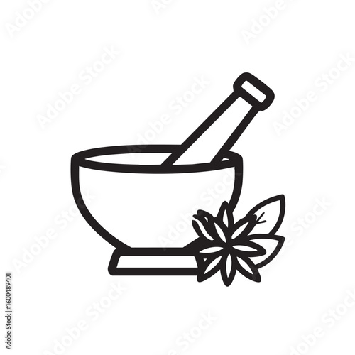 Herbal medicine concept with mortar and pestle alongside leaves