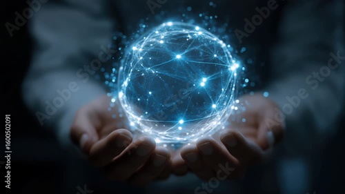 Businessman's open palm holding a glowing, ethereal sphere composed of intricate, interconnected light particles and lines.