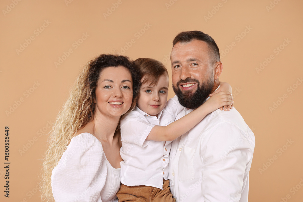 Fototapeta premium Portrait of happy family on beige background