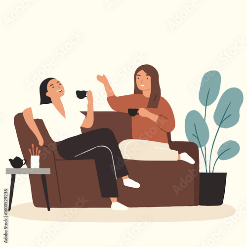 Two women enjoying tea while sitting on a sofa in a cozy living room  