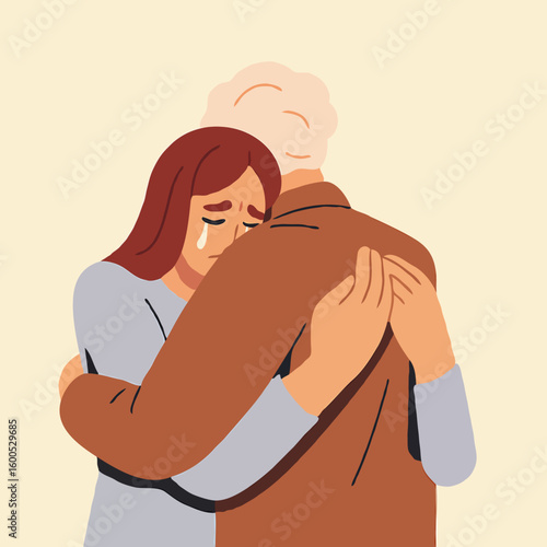 Young woman crying while embracing elderly man in comforting gesture  