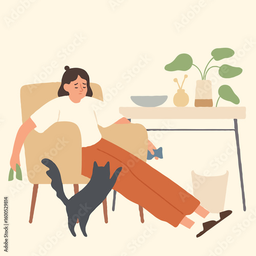 Young woman relaxing in armchair with cat at home 