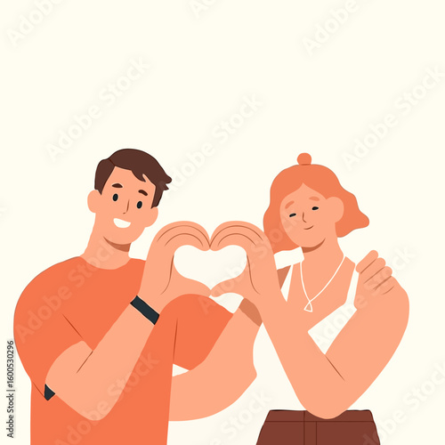 Young couple making heart shape with hands in playful pose  