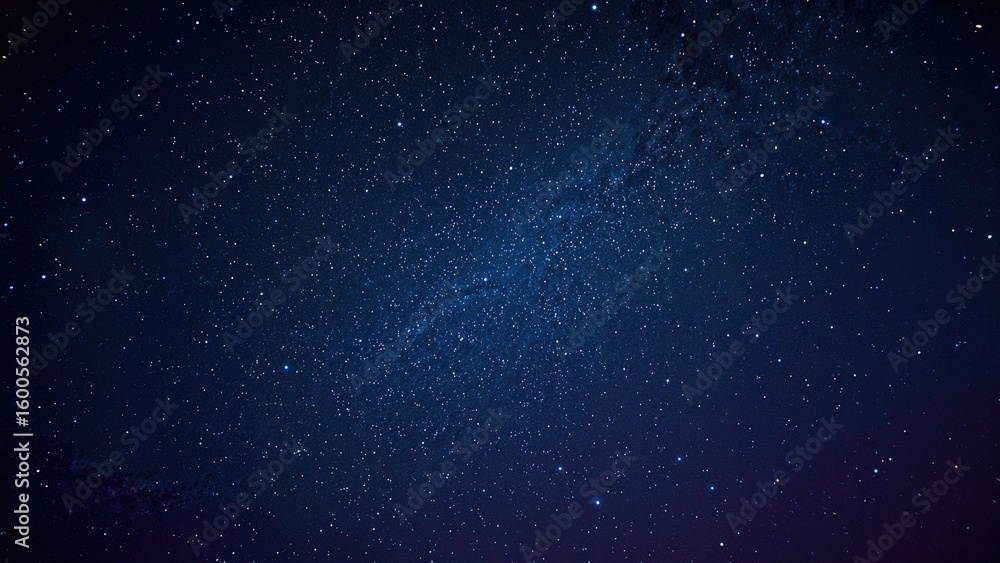 Fototapeta premium Glowing stars scattered across a deep blue and lilac sky