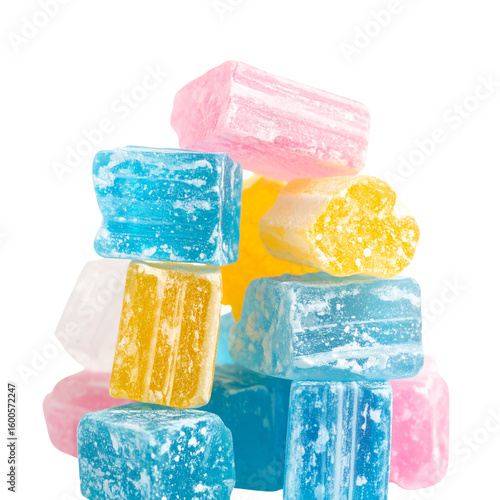 Pastel colored cube candies sweet sugar treat isolated on dark background cube shaped confectionery hard candy stack still life arrangement close up
